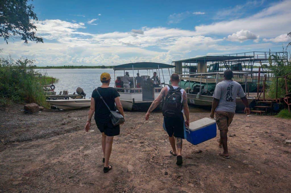 Loading our esky onto our Chobe river cruise 