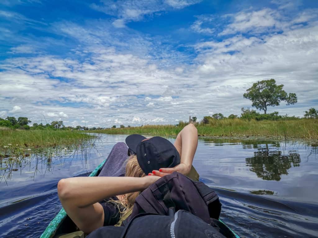 relaxing in mokoro in the Okavango Delta Botswana